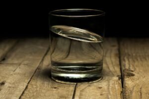 calm-glass-of-water-on-wooden-table