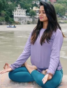 Yogini-perfroming-meditation-river-bank