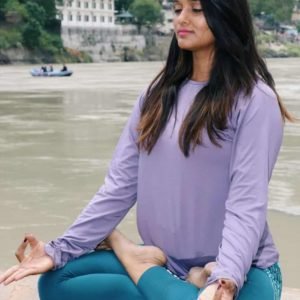 Yogini-perfroming-meditation-river-bank
