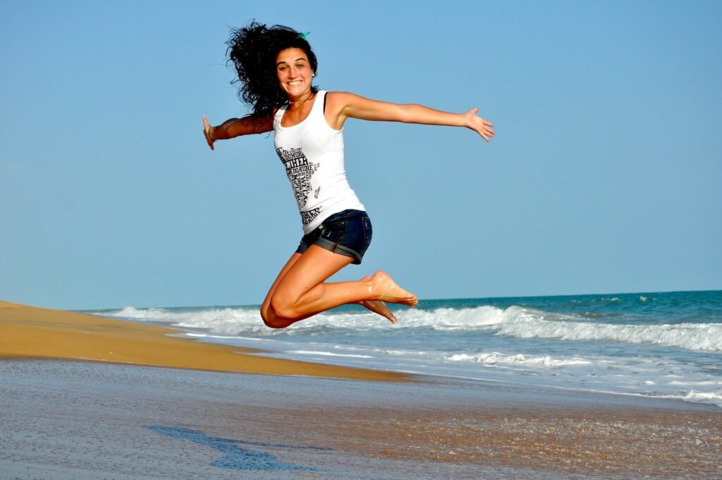 women-jumping-with-happiness-on-the-beach