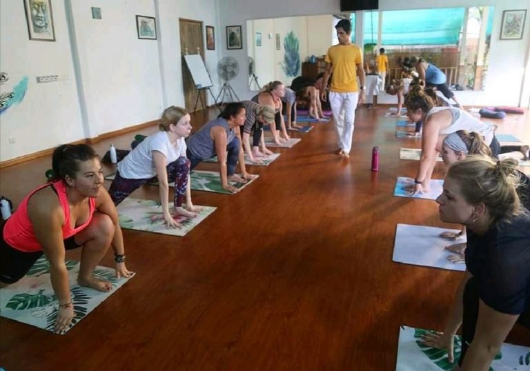 yoga-instructor-teaching-yoga