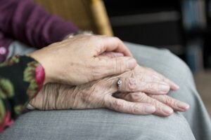 hands-of-old-citizens-on-each-other