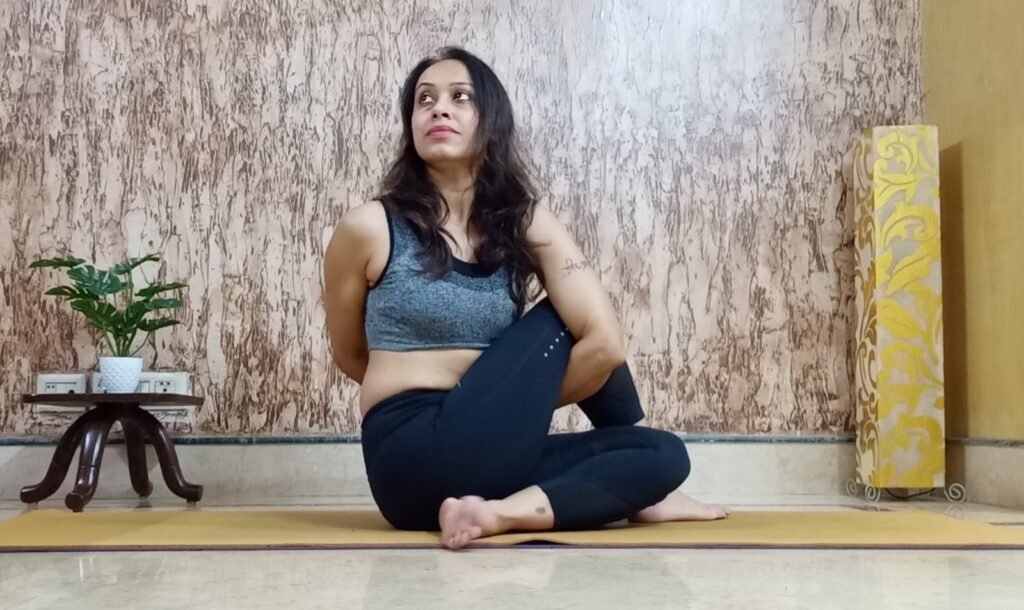 Ardhmatseyendrasana or Seated Twist in hindi