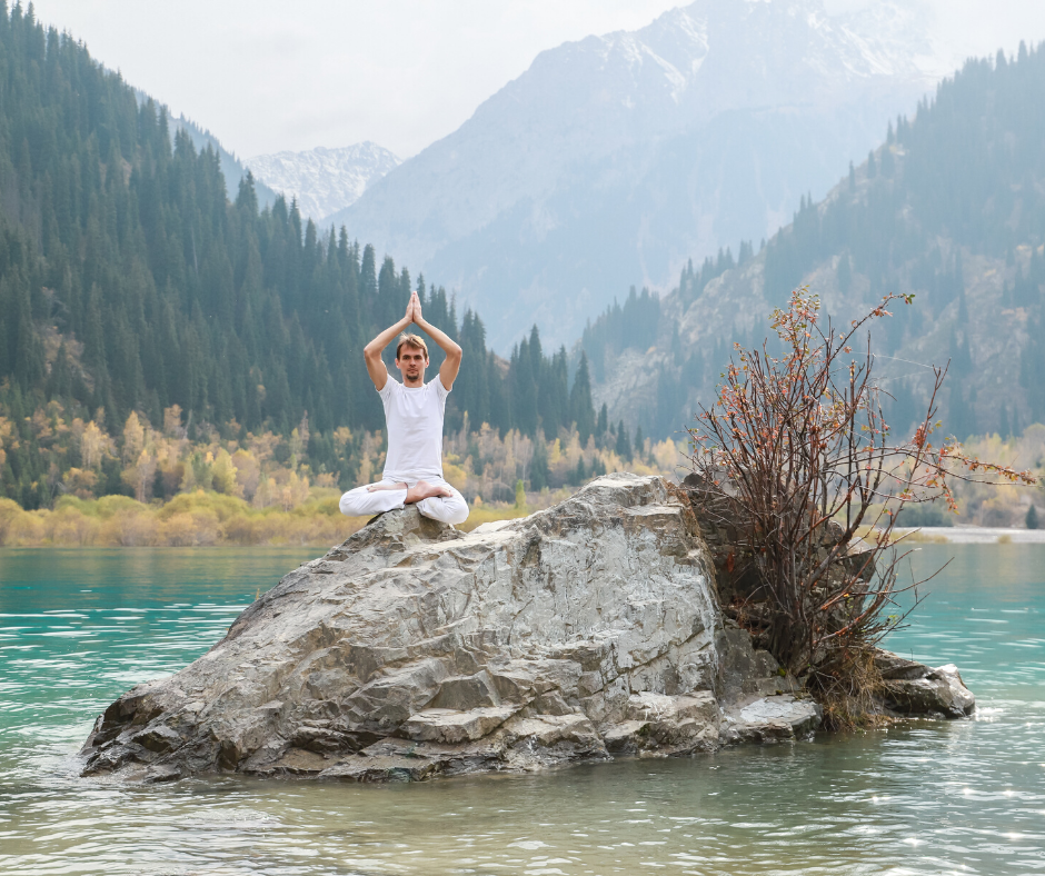 yogi-meditating-on-a-rock-middle-of-lake